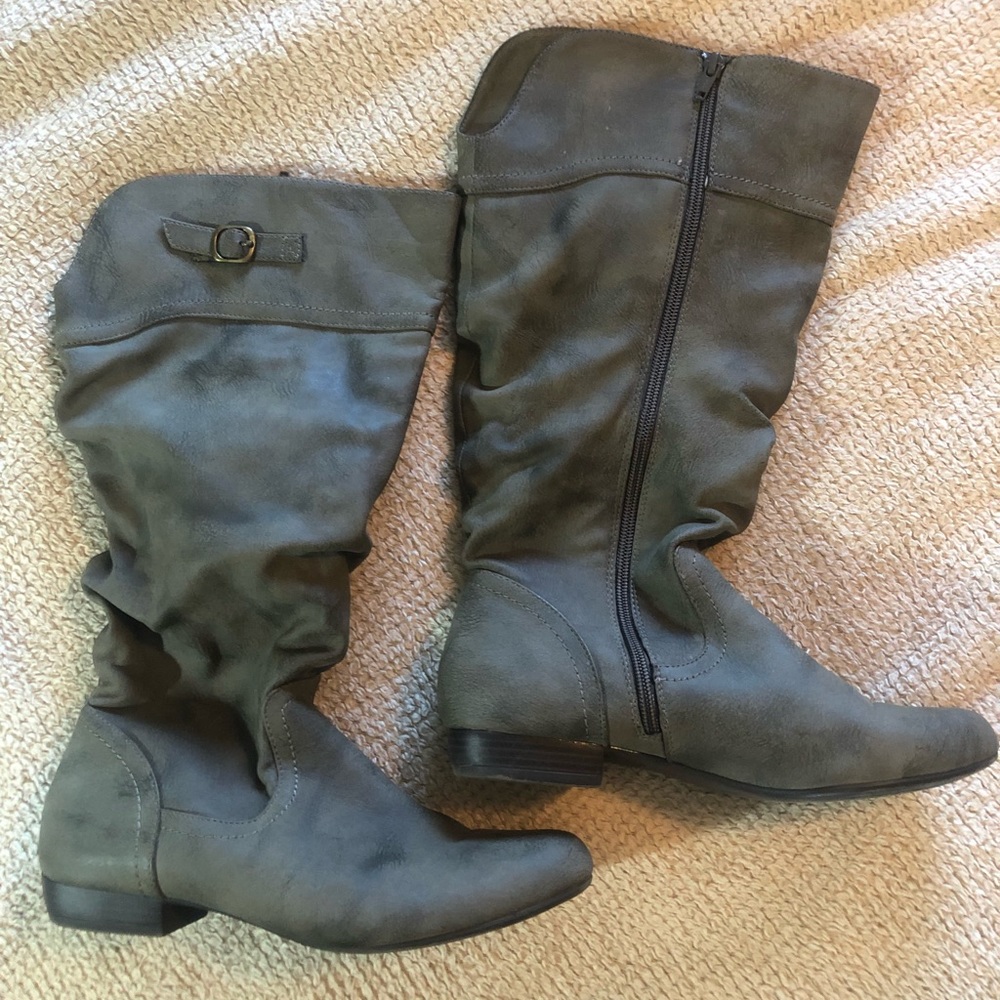 Gray boots about calf high.